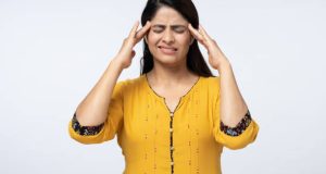 Portrait of young Indian woman on white background